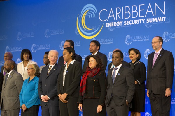 U.S. Vice President Joe Biden speaks to Dominica’s Foreign Minister Francine Baron as they pose for a group photo at the Caribbean Energy Security Summit at the State Department in Washington, Jan. 26, 2015 (AP photo by Jacquelyn Martin).