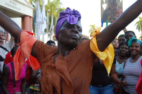 A woman dances to Gaga Afro-Caribbean music during a protest against racial discrimination and “denationalization” of Dominicans of Haitian descent, Santo Domingo, Dominican Republic, March 21, 2014 (AP photo by Ezequiel Abiu Lopez).