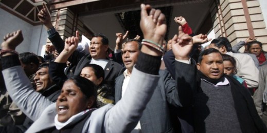 Nepalese opposition lawmakers shout slogans as they walk out of the Constituent Assembly in Kathmandu, Nepal, Jan. 25, 2015 (AP photo by Niranjan Shrestha).