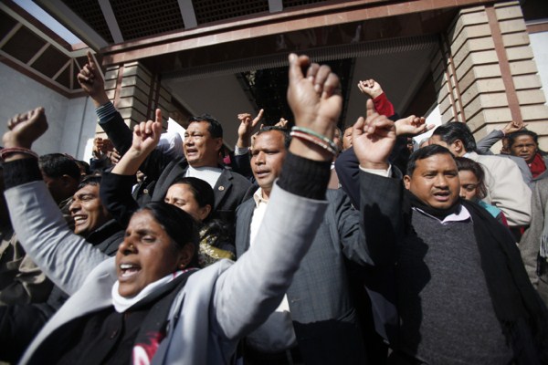 Nepalese opposition lawmakers shout slogans as they walk out of the Constituent Assembly in Kathmandu, Nepal, Jan. 25, 2015 (AP photo by Niranjan Shrestha).
