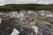Anti-narcotics police set up drugs to be burned on the outskirts of Panama City, Dec. 5, 2014 (AP photo by Arnulfo Franco).