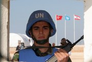 A Turkish member of the U.N. peacekeeping force in Lebanon (UNIFIL) stands in his sentry box at the entrance of the Turkish Engineer Construction Company stationed near the southern port city of Tyre, Nov. 16, 2006 (AP photo by Burhan Ozbilici).