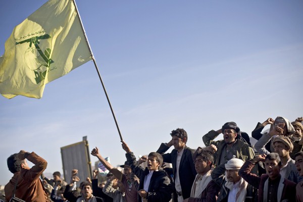 A Houthi Yemeni holding a flag of Hezbollah chants slogans during a rally to show support for their comrades in Sanaa, Yemen, Jan. 28, 2015 (AP photo by Hani Mohammed).