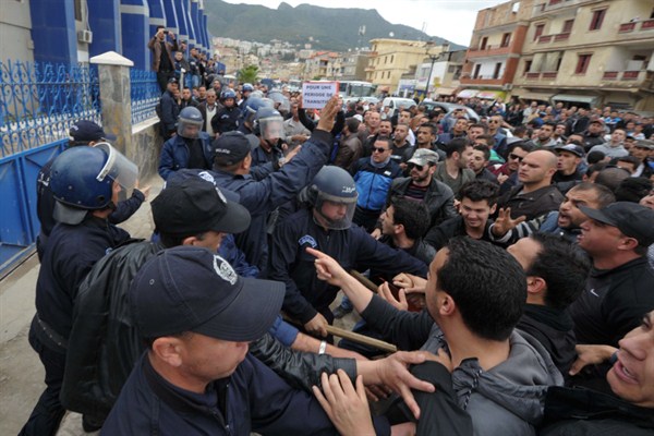 Protesters confront police during a demonstration calling for a boycott of presidential elections, Bejaia, Algeria, April 5, 2014 (AP photo by Sidali Djarboub).