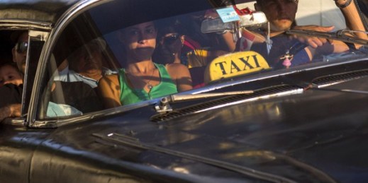 A taxi driver transports a car full of passengers in Havana, Cuba, Feb. 17, 2015 (AP photo by Ramon Espinosa).