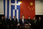 Greek Prime Minister Alexis Tsipras delivers a speech on board the Chinese frigate Changbaishan at the port of Piraeus, near Athens, Feb. 19, 2015 (AP photo by Thanassis Stavrakis).