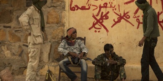 Rebels from the National Movement for the Liberation of the Azawad (NMLA) stand guard outside the former governor’s office, Kidal, Mali, July 26, 2013 (AP photo by Rebecca Blackwell).