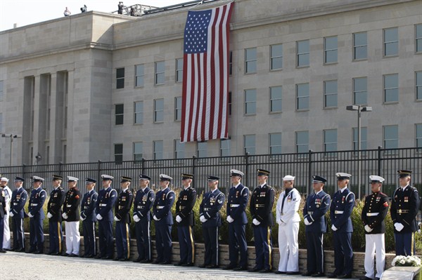 Honor guards stand at the Pentagon Memorial on the 10th anniversary of the September 11 attacks at the Pentagon, Arlington, VA, Sept. 11, 2011 (AP photo by Charles Dharapak).
