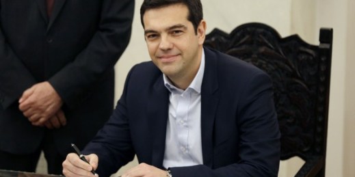 Greek Prime Minister Alexis Tsipras poses for the photographers after taking a secular oath at the Presidential Palace in Athens, Jan. 26, 2015 (AP photo by Thanassis Stavrakis).