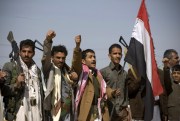 Houthi Shiite Yemenis raise their fists during clashes near the presidential palace in Sanaa, Yemen, Jan. 19, 2015 (AP photo by Hani Mohammed).