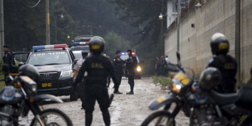 Police agents stand guard during a special operation inside Pavoncito jail, Fraijanes, Guatemala, Sept. 3, 2014 (AP photo by Moises Castillo).