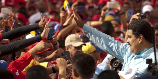 Venezuelan President Nicolas Maduro greets supporters during an anti-imperialist rally with state oil and electric workers at Miraflores presidential palace in Caracas, Venezuela, March 18, 2015 (AP photo by Ariana Cubillos).
