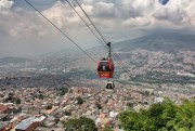 Metrocable cars travel over the slums of Medellin, Colombia, Oct. 31, 2013 (photo by Flickr user Jorge Gobbi licensed under Creative Commons Attribution 2.0 Generic).