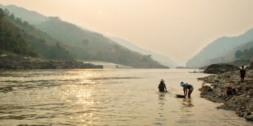 People working in the Mekong River near Luang Prabang, Laos, March 2, 2012 (photo by Flickr user wileyb-j licensed under the Creative Commons Attribution-NonCommercial-NoDerivs 2.0 Generic license.)
