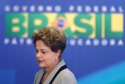 Brazilian President Dilma Rousseff leaves at the end of a government ceremony at the Planalto presidential palace in Brasilia, Brazil, March 16, 2015 (AP photo by Eraldo Peres).