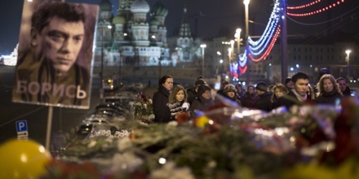 Mourners pay their respects at the place where Boris Nemtsov was murdered near the Kremlin, with St. Basil’s Cathedral in the background, Moscow, Russia, March 2, 2015 (AP photo by Alexander Zemlianichenko).