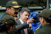 Colombian President Juan Manuel Santos speaks to police officers during an event to launch a Christmas security plan, Bogota, Colombia, Dec. 1, 2014 (AP photo by Fernando Vergara).