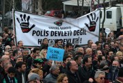 Thousands of members of Turkey’s Bar Associations march to the Parliament with a banner that reads “The state of law, not state of police!” in Ankara, Turkey, Feb. 16, 2015 (AP photo by Burhan Ozbilici).