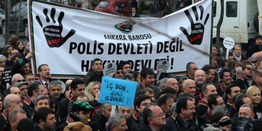 Thousands of members of Turkey’s Bar Associations march to the Parliament with a banner that reads “The state of law, not state of police!” in Ankara, Turkey, Feb. 16, 2015 (AP photo by Burhan Ozbilici).