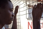 A juvenile detainee stares out the window at the Naguru Remand Home, Kampala, Uganda, Nov. 13, 2006 (photo by Flickr user Endre Vestvik, licensed under Creative Commons Attribution-NonCommercial-ShareAlike 2.0 Generic license).