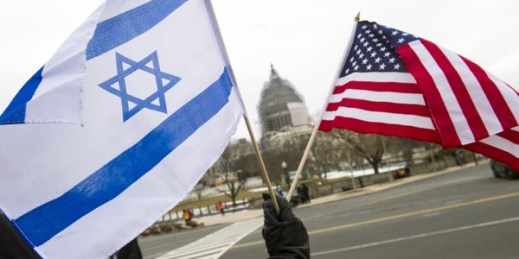 A pro-Israel demonstrator waves flags near the Capitol in Washington, D.C., March 3, 2015 (AP photo by Cliff Owen).