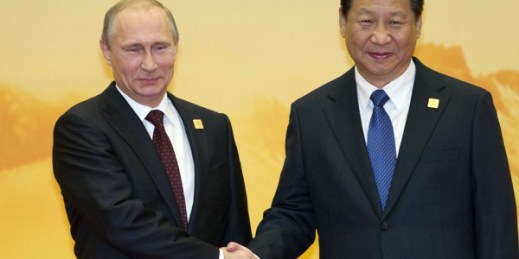 Russian President Vladimir Putin shakes hands with Chinese President Xi Jinping during a welcome ceremony for the Asia-Pacific Economic Cooperation (APEC) Economic Leaders Meeting, Beijing, China, Nov. 11, 2014 (AP photo by Ng Han Guan).