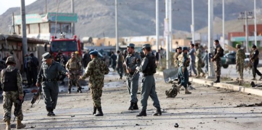 Afghan security personnel gather at the site of a suicide attack, Kabul, Afghanistan, April 10, 2015 (AP photo by Rahmat Gul).