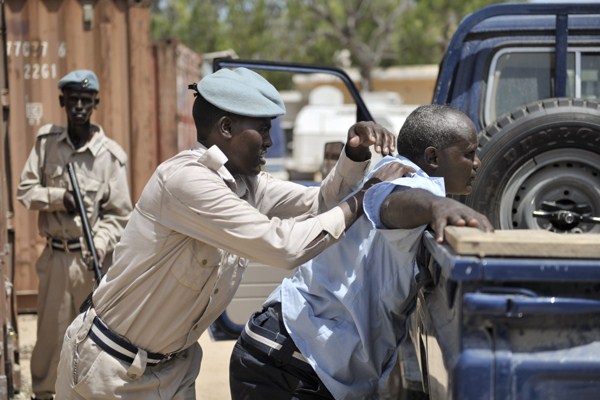 Somali police officers take part in a training exercise to stop and search a vehicle at General Kahiye Police Academy, Mogadishu, Somalia, June 16, 2014 (U.N. photo by Tobin Jones).