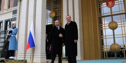 Russian President Vladimir Putin and Turkish President Recep Tayyip Erdogan shake hands after a welcome ceremony at the new Presidential Palace, Ankara, Turkey, Dec. 1, 2014 (AP photo by Burhan Ozbilici).