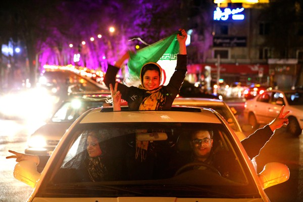 Iranians celebrate the announcement that Iran and six world powers have reached a preliminary nuclear agreement, Tehran, Iran, April 2, 2015 (AP photo by Ebrahim Noroozi).