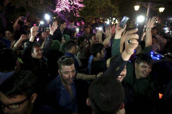 Iranians celebrate a framework agreement on their country’s nuclear program between the Islamic Republic and six world powers, Tehran, Iran, April 3, 2015 (AP photo by Vahid Salemi).
