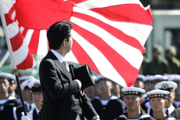 Japanese Prime Minister Shinzo Abe reviews members of Japan’s Self-Defense Forces (SDF) during the Self-Defense Forces Day at Asaka Base, north of Tokyo, Oct. 27, 2013 (AP photo by Shizuo Kambayashi).