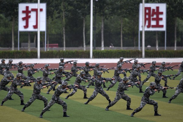 Chinese People’s Liberation Army cadets take part in a bayonet drills at the PLA’s Armored Forces Engineering Academy Base, Beijing, China, July 22, 2014 (AP photo by Andy Wong).