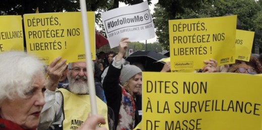 Demonstrators hold placards reading “Say No to Mass Surveillance” and “Members of Parliament Protect our Freedom,” Paris, France, May 4, 2015 (AP photo by Francois Mori).