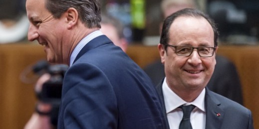 British Prime Minister David Cameron walks by French President Francois Hollande during a round table meeting at an EU summit in Brussels, March 19, 2015 (AP photo by Geert Vanden Wijngaert).