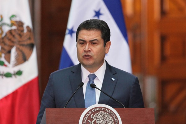 Honduran President Juan Hernandez Alvarado speaks at the National Palace in Mexico City, March 13, 2015 (AP photo by Marco Ugarte).