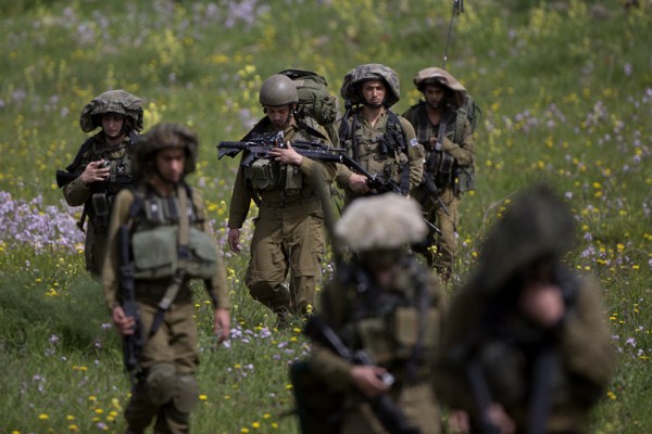Israeli soldiers march during training in the Israeli-controlled Golan Heights, near the border with Syria, March 9, 2015 (AP photo by Ariel Schalit).