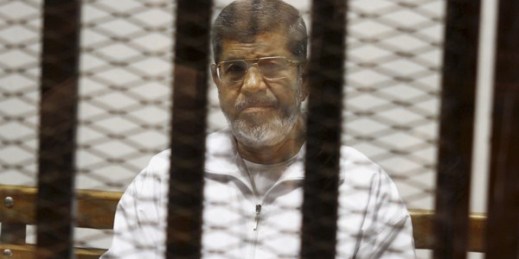 Egypt’s ousted Islamist President Mohammed Morsi sits in a defendant cage in the Police Academy courthouse in Cairo, Egypt, May 8, 2014 (AP photo by Tarek el-Gabbas).