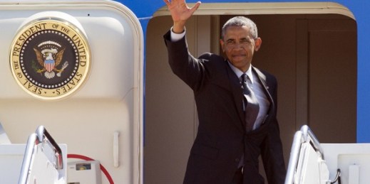 U.S. President Barack Obama waves from the doorway of Air Force One, Andrews Air Force Base, Md., May 4, 2015 (AP photo by Cliff Owen).