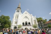 People stand outside as parishioners leave the Emanuel A.M.E. Church, Charleston, S.C., June 21, 2015 (AP photo by Stephen B. Morton).