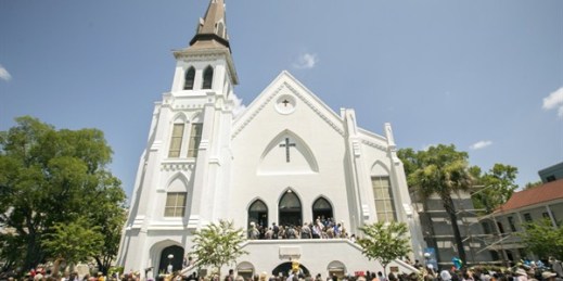 People stand outside as parishioners leave the Emanuel A.M.E. Church, Charleston, S.C., June 21, 2015 (AP photo by Stephen B. Morton).