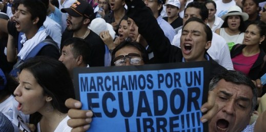 Demonstrators hold a sign that reads in Spanish "We march for a free Ecuador" during an opposition march, Guayaquil, Ecuador, June 25, 2015 (AP photo by Dolores Ochoa).