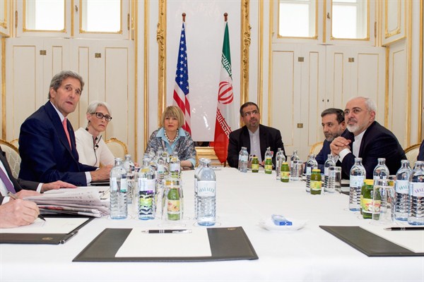 U.S. Secretary of State John Kerry sits across from Iranian Foreign Minister Javad Zarif and other advisers, Vienna, Austria, June 27, 2015 (State Department photo).