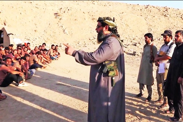 Screenshot of a YouTube video of an alleged Islamic State boot camp graduation, taken on Oct. 13, 2014 (photo from Flickr user hinkelstone licensed under the Creative Commons Attribution 2.0 Generic license).
