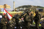 Hezbollah fighters stand guard during a rally commemorating "Liberation Day," which marks the withdrawal of the Israeli army from southern Lebanon in 2000, Nabatiyeh, Lebanon, May 24, 2015 (AP photo by Mohammed Zaatari).