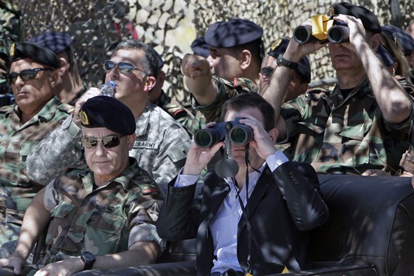 U.S. Ambassador to Lebanon David Hale looks through binoculars during a live-fire demonstration of advanced TOW-II missile, Taybeh, Lebanon, June 10, 2015 (AP photo by Bilal Hussein).
