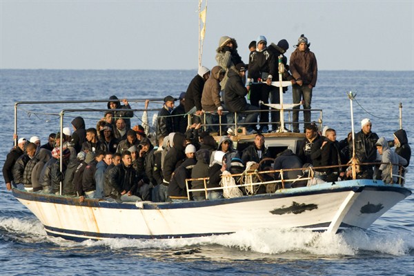 A boat loaded with migrants is spotted at sea off the Sicilian island of Lampedusa, Italy, March 7, 2011 (AP photo by Antonello Nusca).