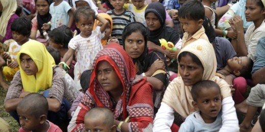 Ethnic Rohingya women and children gather to receive a meal at a temporary shelter, Bayeun, Aceh province, Indonesia, May 23, 2015 (AP photo by Tatan Syuflana).