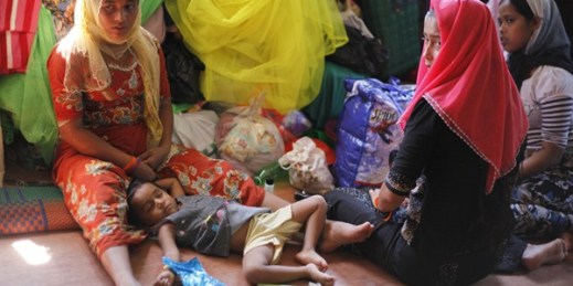 Rohingya migrants sit in their room at a temporary shelter, Bayeun, Aceh Province, Indonesia, June 1, 2015 (AP photo by Binsar Bakkara).