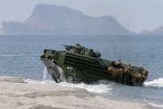 A U.S. Navy amphibious assault vehicle with Philippine and U.S. troops on board storms the beach facing one of the contested islands in the Scarborough Shoal, South China Sea, April 21, 2015 (AP photo by Bullit Marquez).